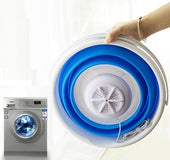 Folding bucket turbine washing machine