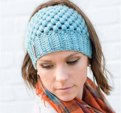 Europe and the United States new knit hat winter ladies horsetail hat autumn and winter earmuffs wool hat fashion labeling empty top hat