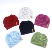 Europe and the United States new knit hat winter ladies horsetail hat autumn and winter earmuffs wool hat fashion labeling empty top hat