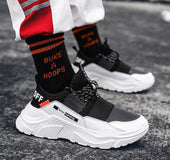 Spring flying woven breathable men's shoes foreign trade trend sports and leisure shoes wild men's running shoes