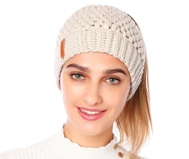 Europe and the United States new knit hat winter ladies horsetail hat autumn and winter earmuffs wool hat fashion labeling empty top hat