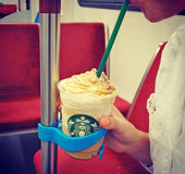 Portable public transportation cup holder