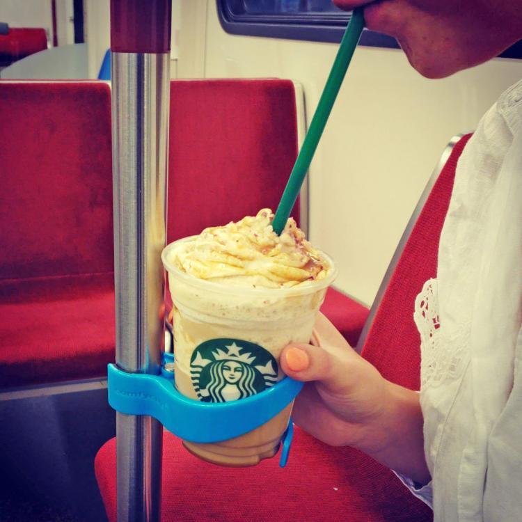 Portable public transportation cup holder